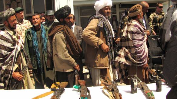Former Taliban fighters line up to handover their Rifles to the Government of the Islamic Republic of Afghanistan during a reintegration ceremony at the provincial governor’s compound. Wikimedia Commons