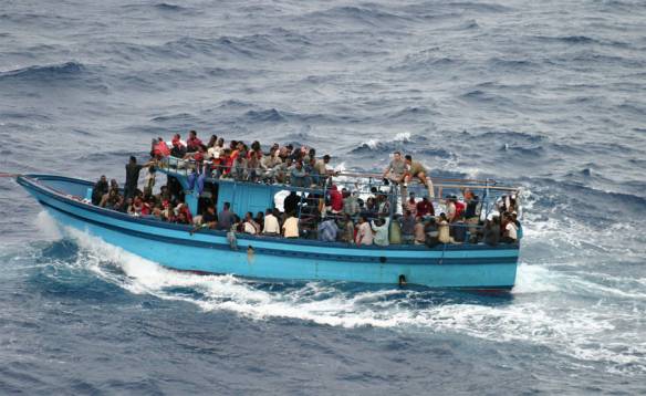 A boat carrying asylum seekers and migrants in the Mediterranean Sea. Photo: NHCR/L.Boldrini