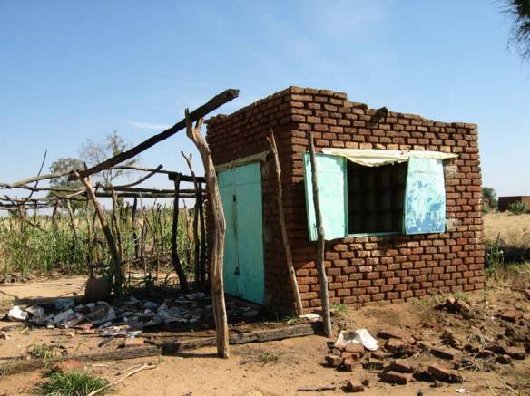 A village health post destroyed by Jingaweit militia.  By United States Agency for International Development [Public domain], via Wikimedia Commons