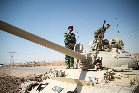 Kurdish Peshmerga on a T-55-Tank outside Kirkuk in Iraq. Photo: Boris Niehaus. CC BY-SA 3.0