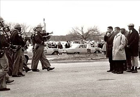 Confrontation at the Edmund Pettus Bridge, Selma, 7 March 1965. John Lewis on the right in a white coat.