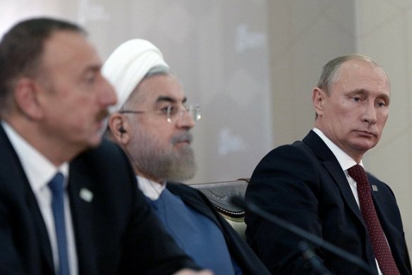Putin tries to make a clever face, and Rouhani doesn't have to.