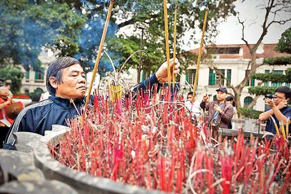 Vietnamese protesters burn incense to pray on the anniversary of  64 Vietnamese soldiers who died on 14 March 1988 during an attack by Chinese soldiers on Gac Ma island, one of the disputed Spratly Islands, in Hanoi, Vietnam, 14 March 2013. The protesters also shout slogans asking for an end of Chinese aggression in the South China Sea, parts of which are claimed by both Vietnam and China.  EPA/LUONG THAI LINH