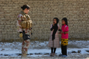 One of the military gender advisers talking to local kids in Faryab. Photo: Geir Bøe/Norwegian Defence